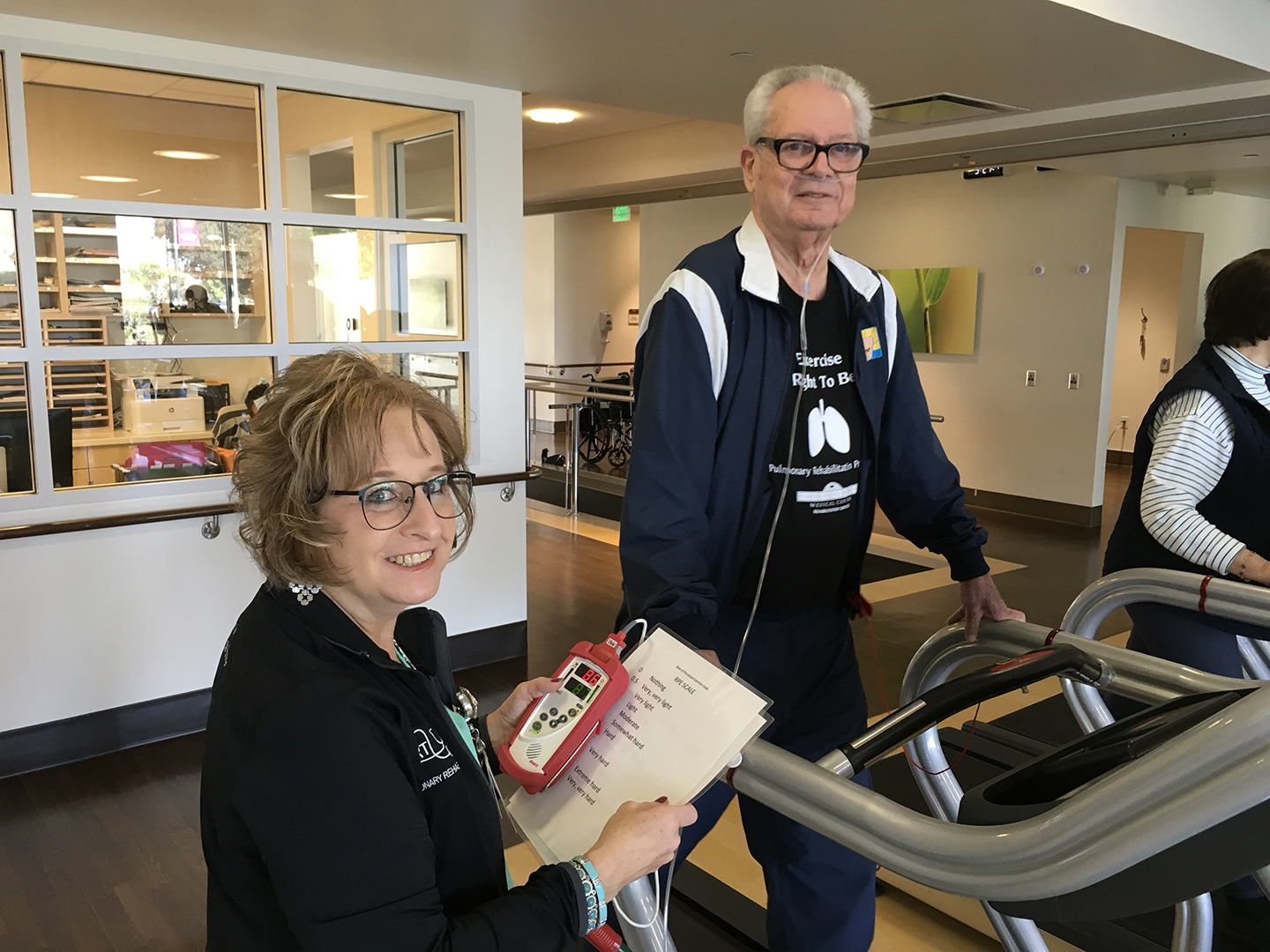 Doctor and pulmonary rehabilitation patient on a treadmill 