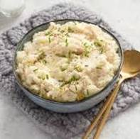 A bowl of food with a spoon

AI-generated content may be incorrect.